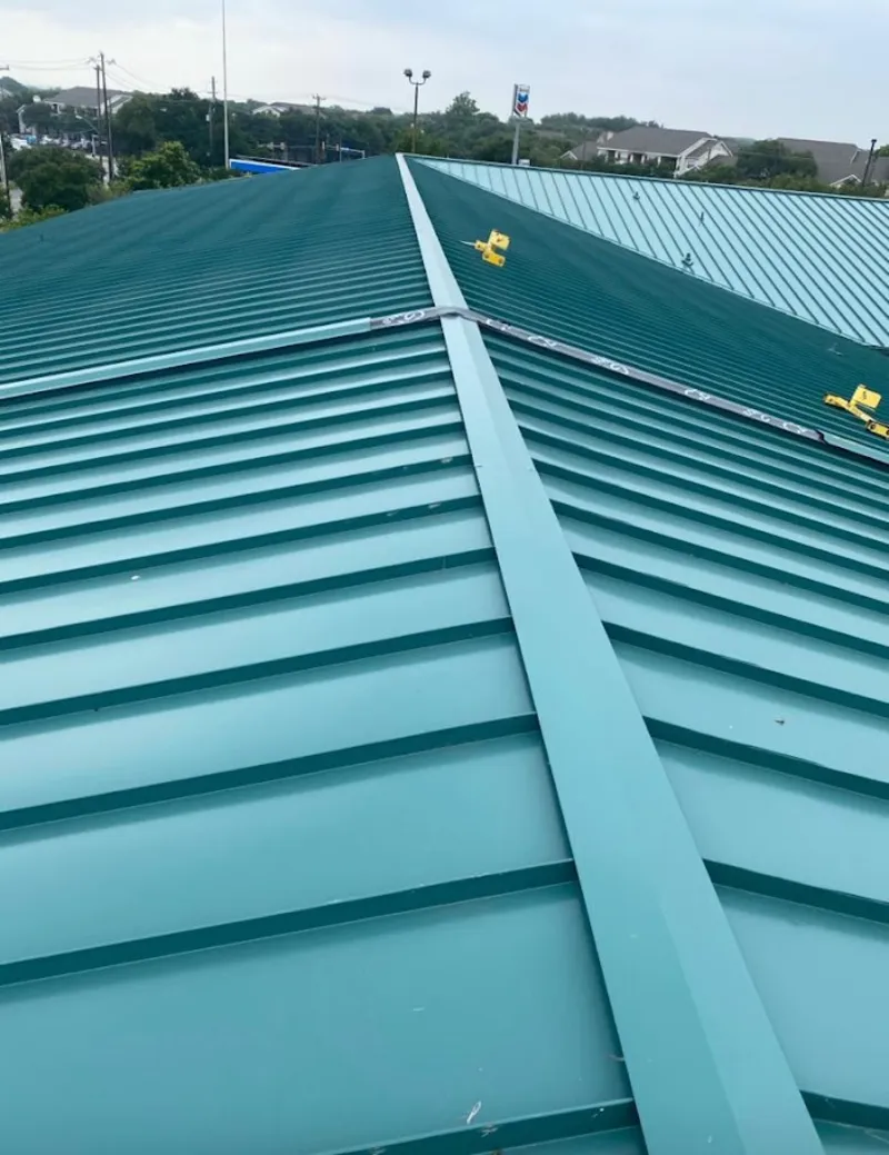 Green commercial metal roof ridge and valley for Metal Roof Repair in Navasota